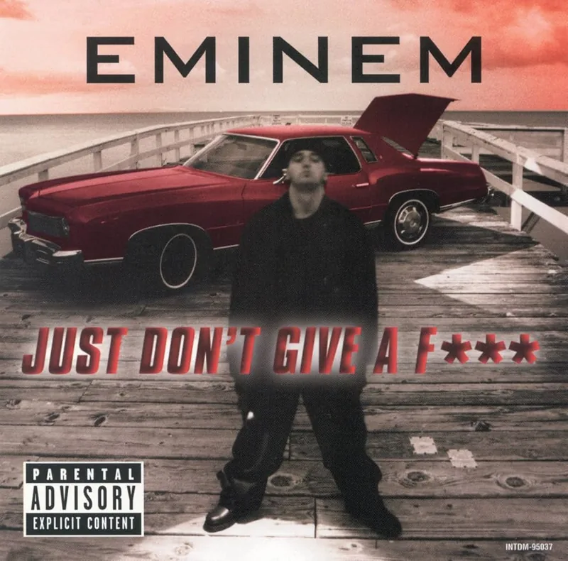 赤い車の前にEminemが立つJust Don’t Give a Fuckのシングルジャケット